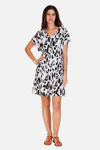 Buttoned dress with pockets in designer print with short sleeves