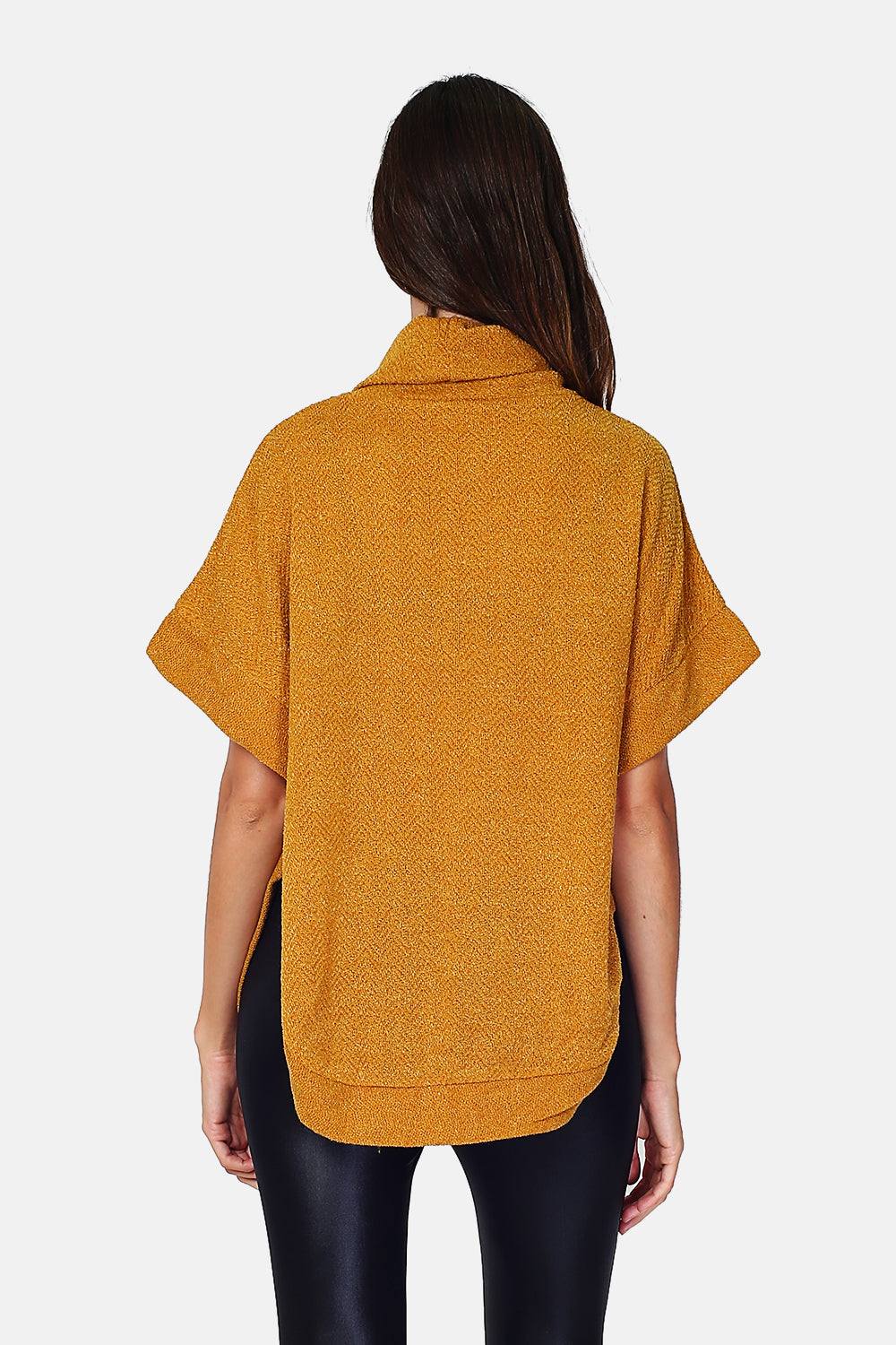 Turtleneck tunic in poncho buttoning on the sides