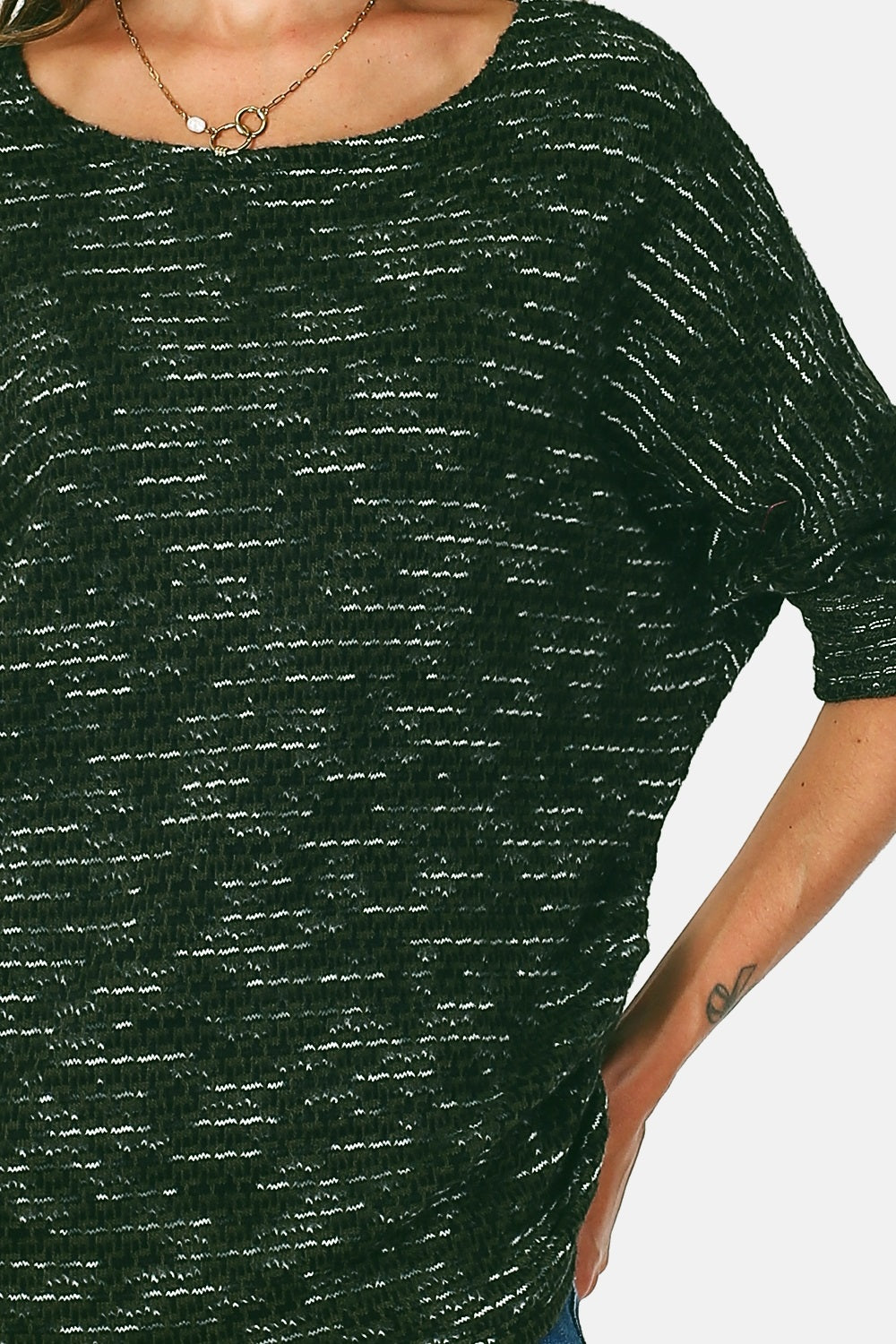 Asymmetrical crew neck sweater with batwing sleeves