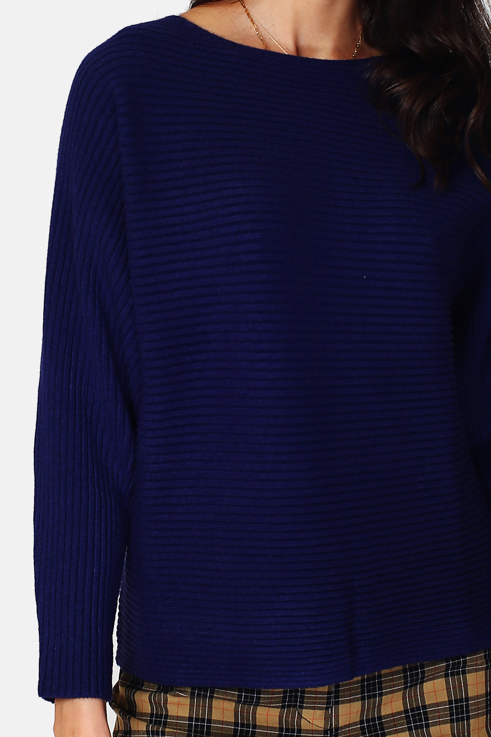 Wide ribbed sweater with boat neck and long sleeves