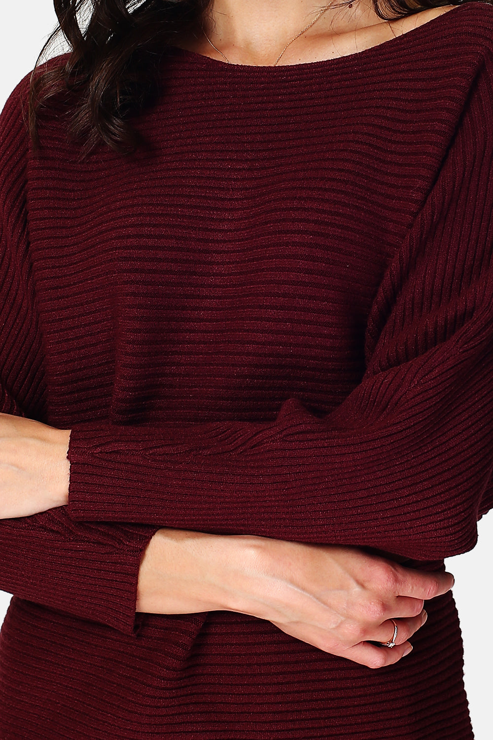 Wide ribbed sweater with boat neck and long sleeves