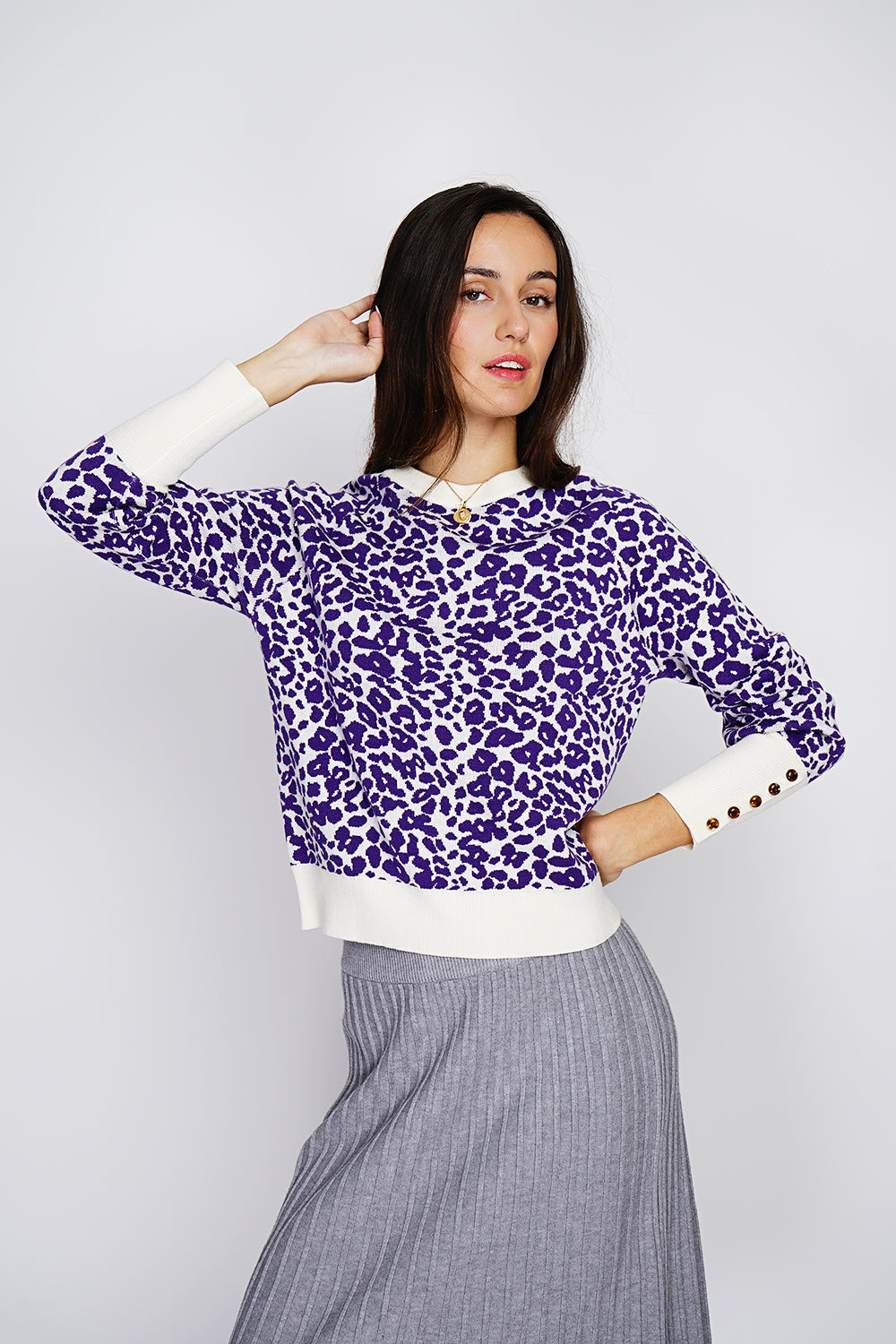 Wide round neck leopard knitted sweater with long, slightly balloon sleeves with button placket at the bottom of the sleeves