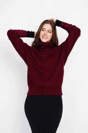 Nervous ball neck sweater with batwing sleeves