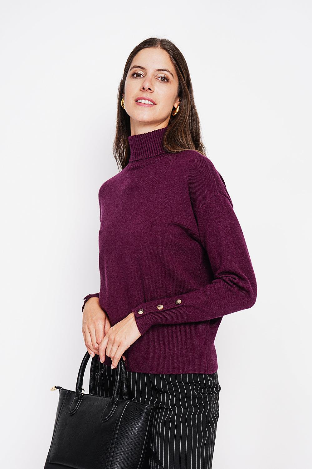 Turtleneck sweater with low front buttoned and long sleeves