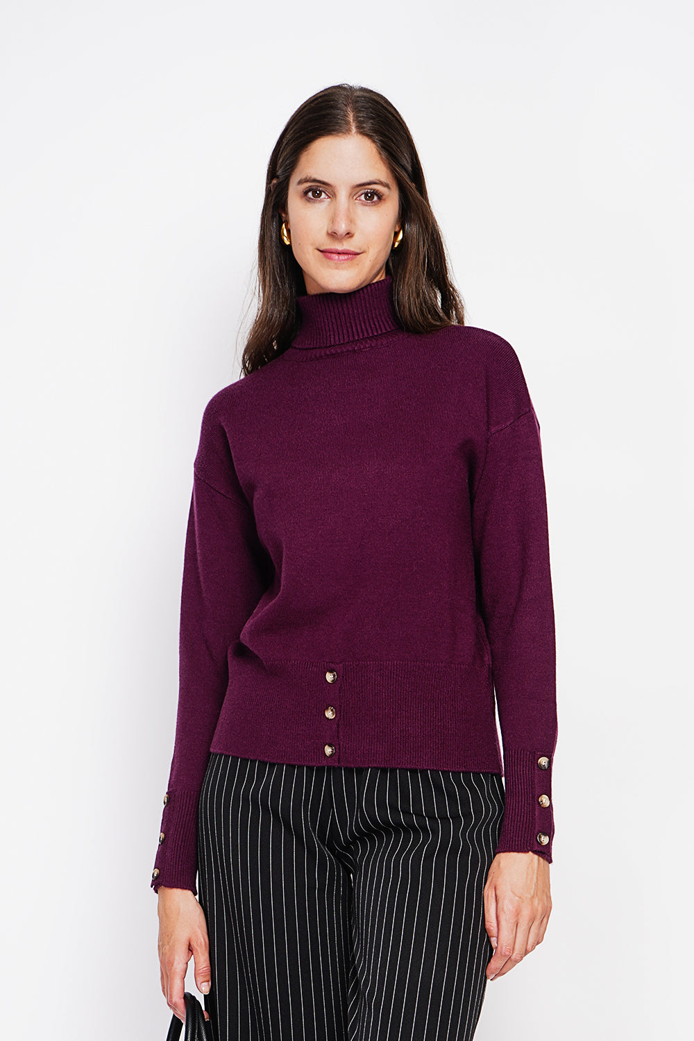 Turtleneck sweater with low front buttoned and long sleeves