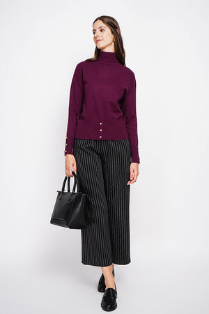 Turtleneck sweater with low front buttoned and long sleeves
