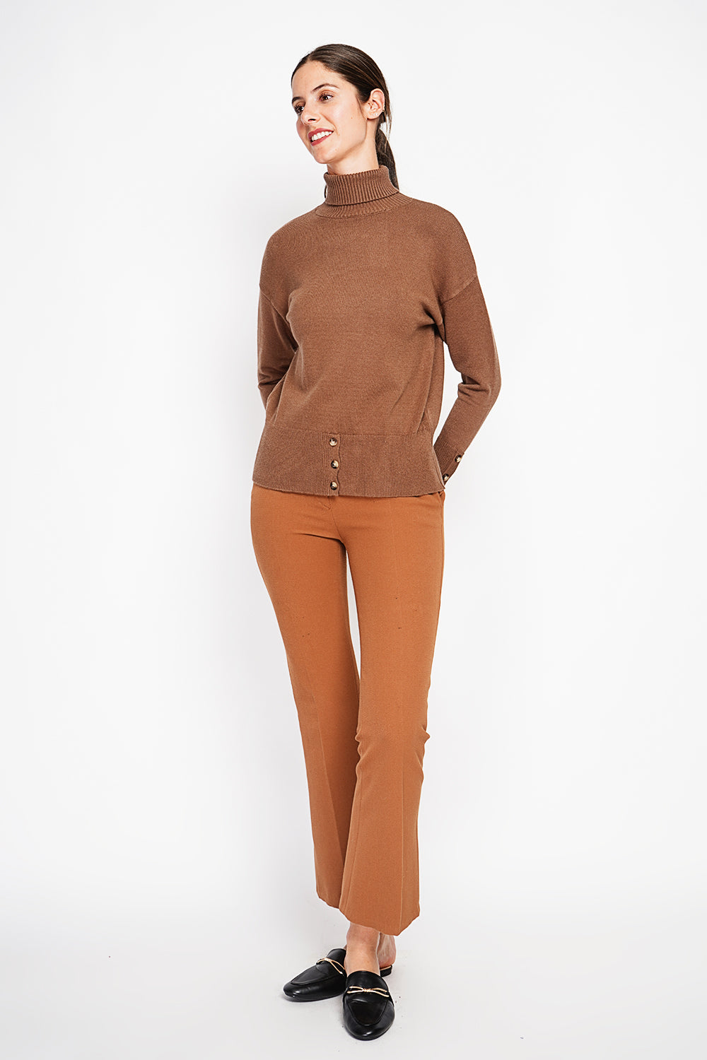 Turtleneck sweater with low front buttoned and long sleeves
