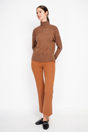 Turtleneck sweater with low front buttoned and long sleeves
