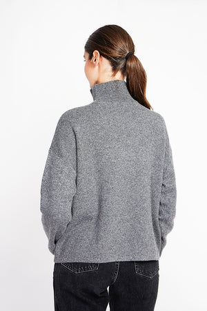 High neck sweater with oversized zip front pocket and long sleeves
