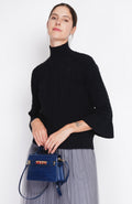 Pull col montant torsadé manches mousquetaire – Noir – Assuili
