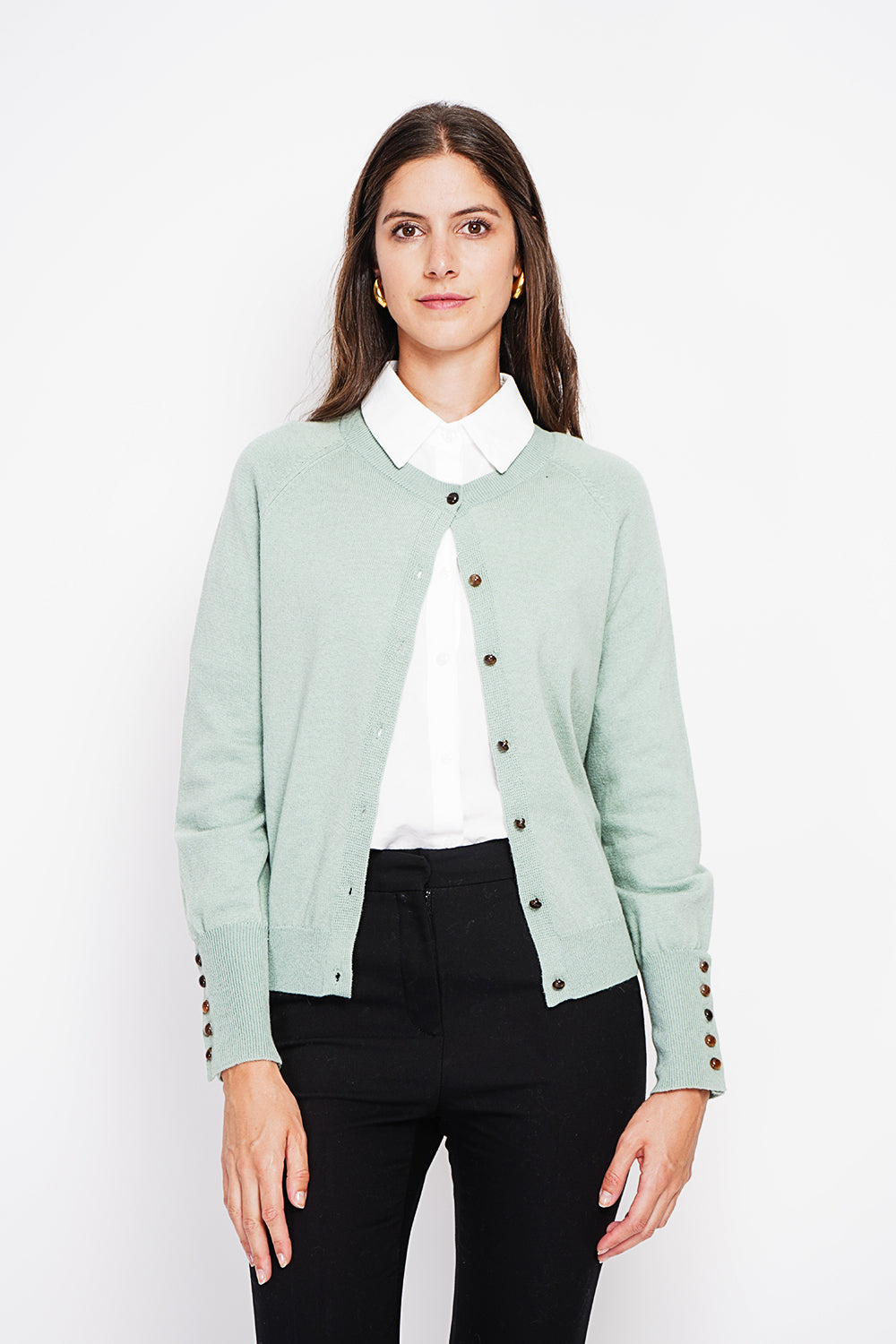 Crew neck oversized cut vest with button placket at the bottom of the long sleeves