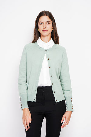 Crew neck oversized cut vest with button placket at the bottom of the long sleeves