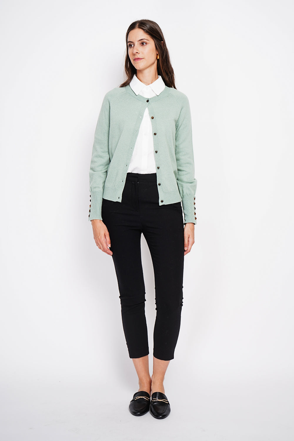 Crew neck oversized cut vest with button placket at the bottom of the long sleeves