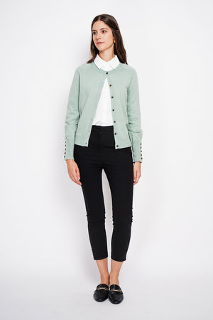 Crew neck oversized cut vest with button placket at the bottom of the long sleeves
