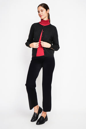 Crew neck oversized cut vest with button placket at the bottom of the long sleeves