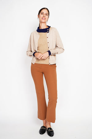 Crew neck oversized cut vest with button placket at the bottom of the long sleeves