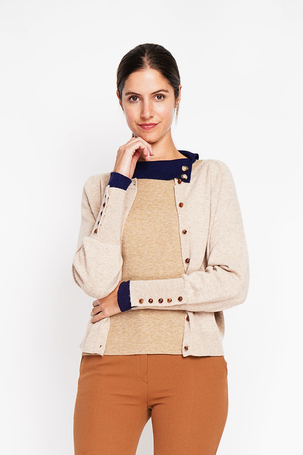 Crew neck oversized cut vest with button placket at the bottom of the long sleeves