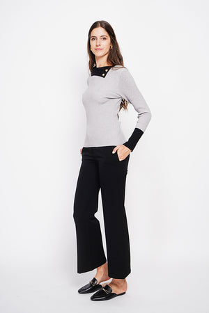 High neck sweater with buttons on the collar and long sleeves