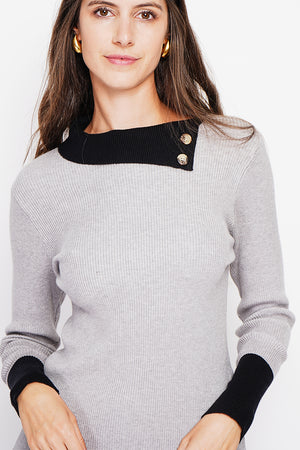 High neck sweater with buttons on the collar and long sleeves