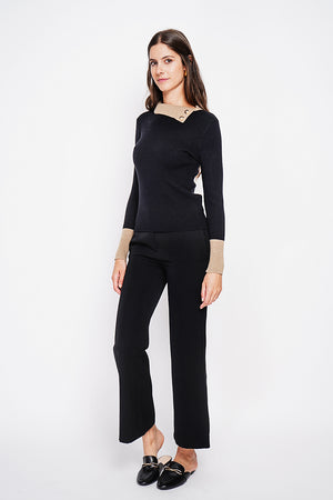 High neck sweater with buttons on the collar and long sleeves