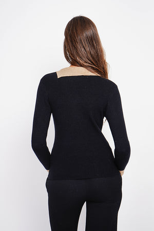 High neck sweater with buttons on the collar and long sleeves