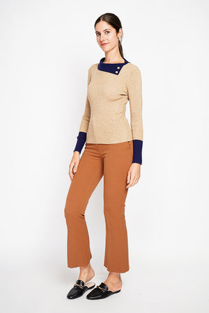 High neck sweater with buttons on the collar and long sleeves