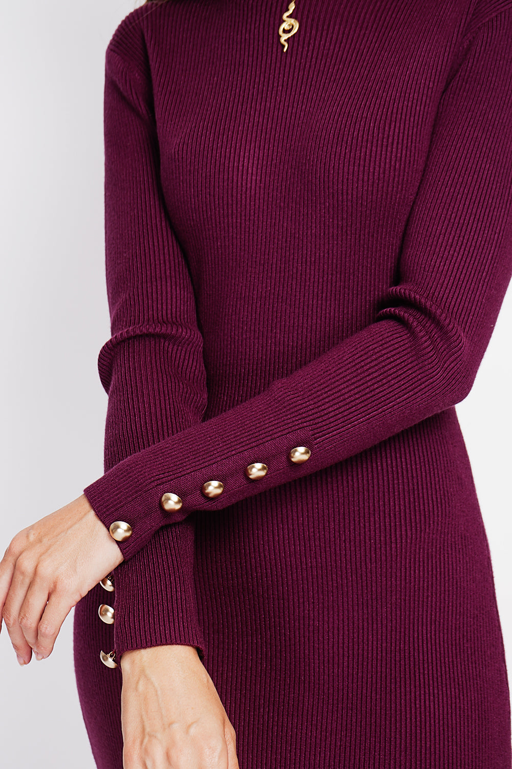 Ribbed high neck dress with buttoning on the long sleeves