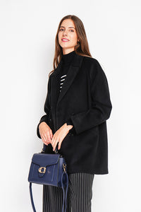 Oversized double-breasted coat with long sleeves and pockets, lined with print