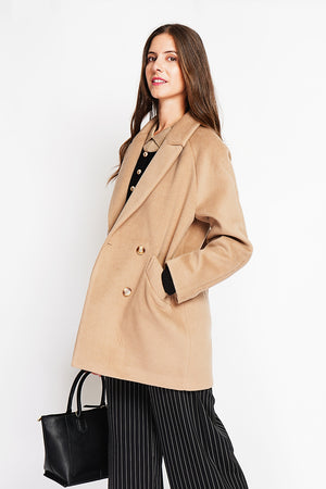 Oversized double-breasted coat with long sleeves and pockets, lined with print