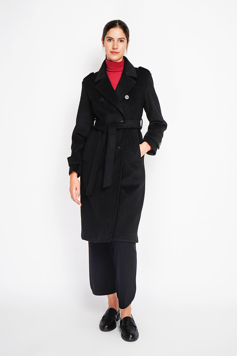 Long lined coat with tailored collar belt and pockets Lined back slit.