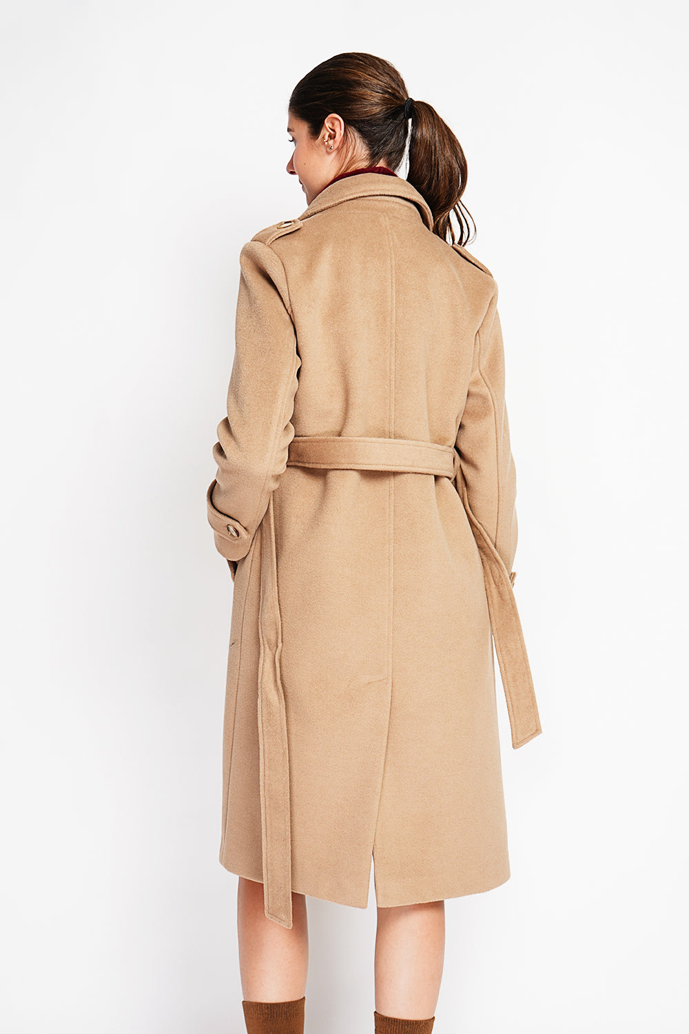 Long lined coat with tailored collar belt and pockets Lined back slit.