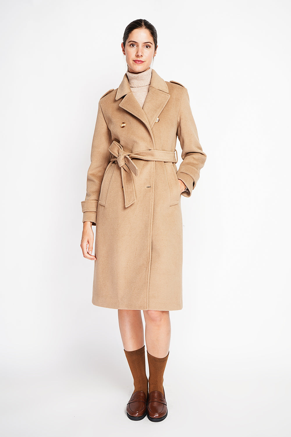 Long lined coat with tailored collar belt and pockets Lined back slit.