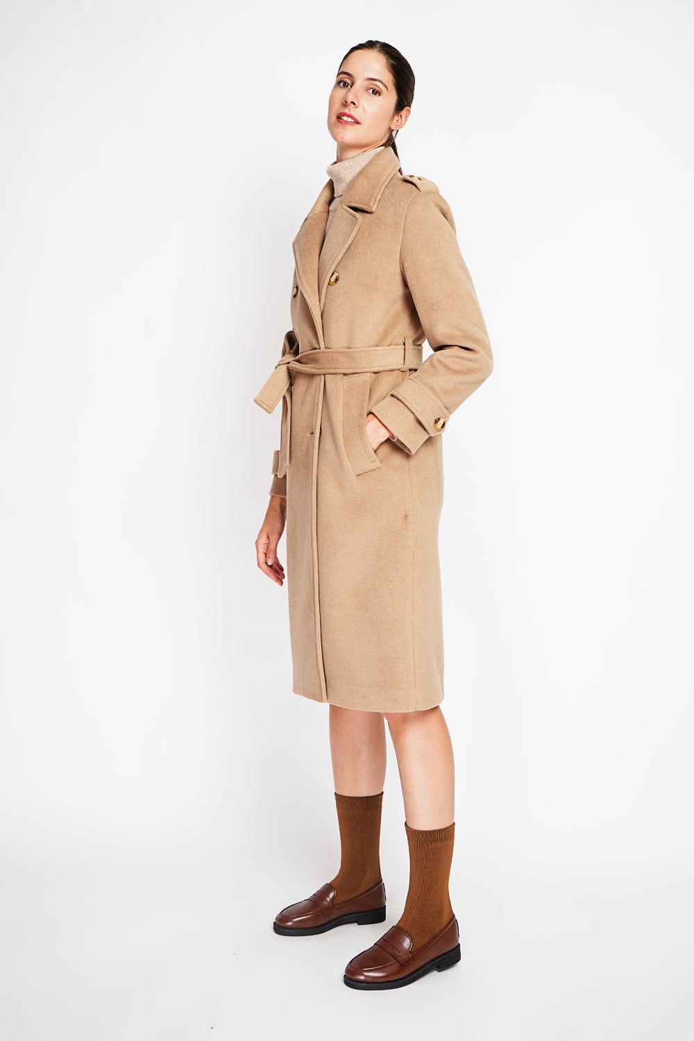 Long lined coat with tailored collar belt and pockets Lined back slit.