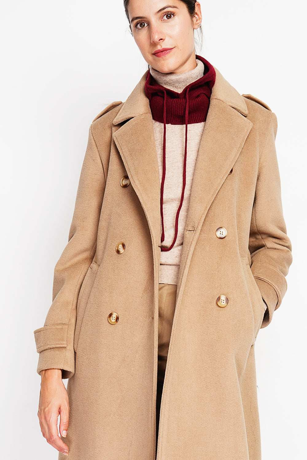Long lined coat with tailored collar belt and pockets Lined back slit.