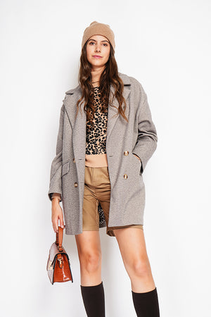Oversized coat with flap pockets and long sleeves