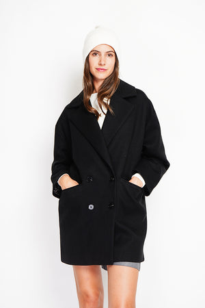 Oversized coat with flap pockets and long sleeves