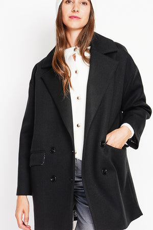 Oversized coat with flap pockets and long sleeves