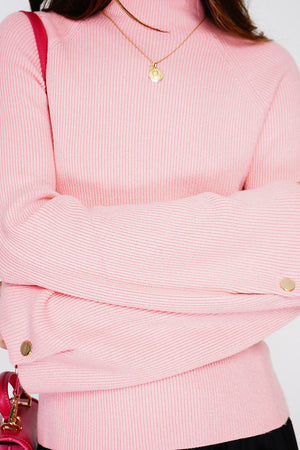 High-neck ribbed sweater with buttons on long sleeves