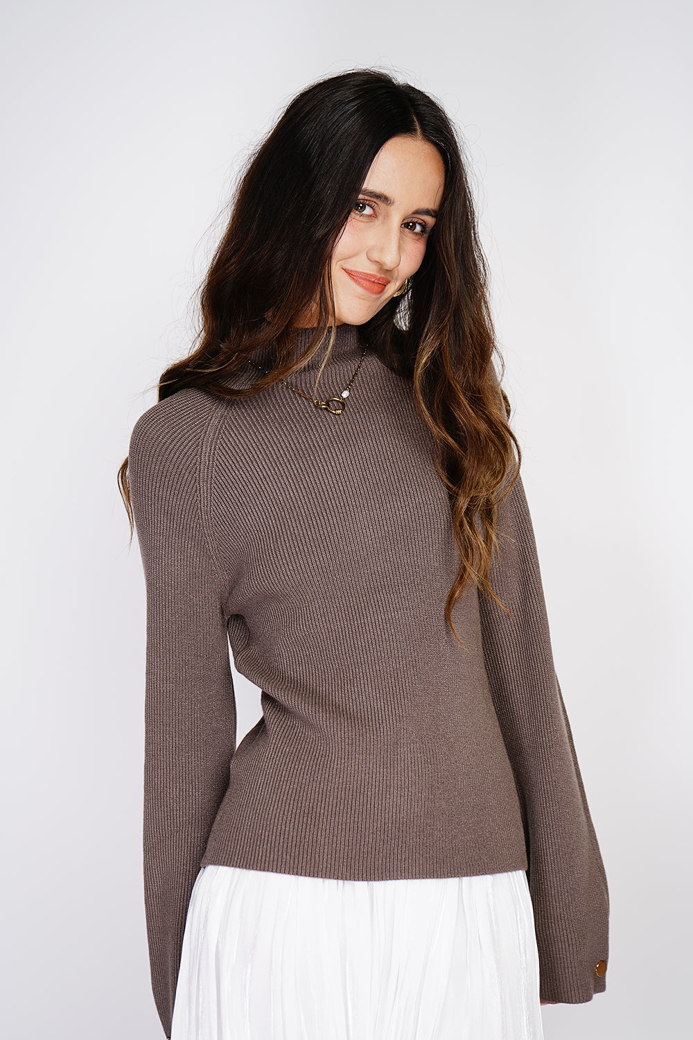 High-neck ribbed sweater with buttons on long sleeves