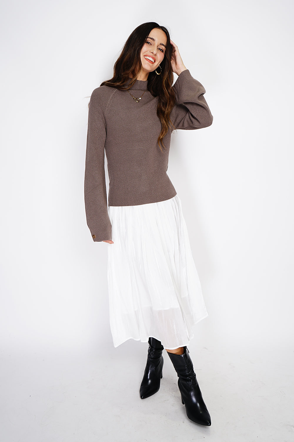 High-neck ribbed sweater with buttons on long sleeves