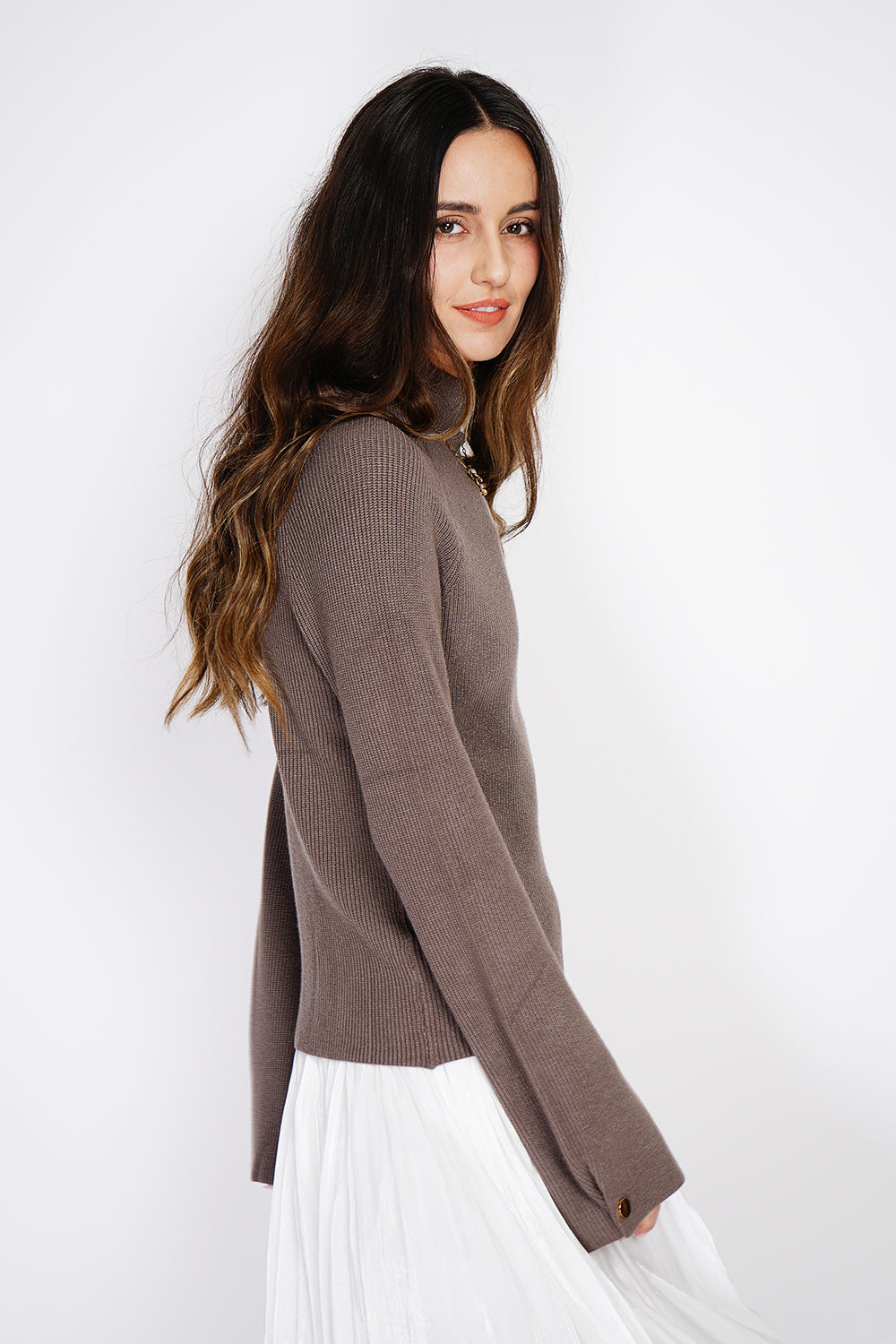 High-neck ribbed sweater with buttons on long sleeves