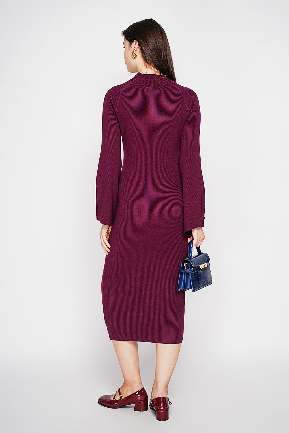 Ribbed high neck dress with buttoning on the long sleeves