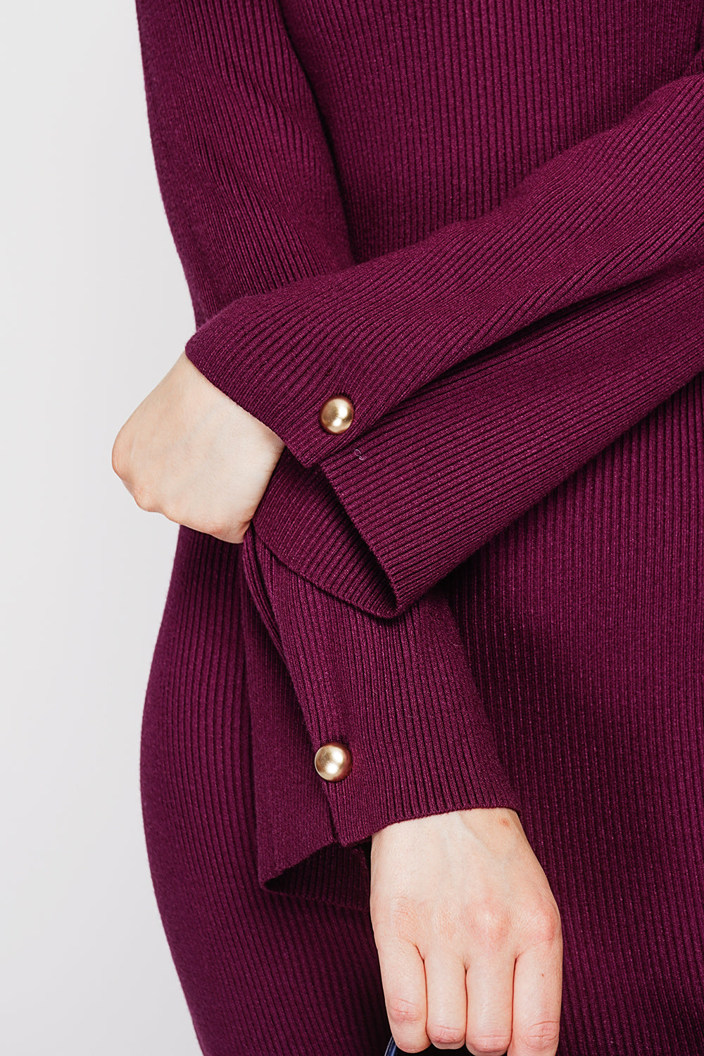 Ribbed high neck dress with buttoning on the long sleeves