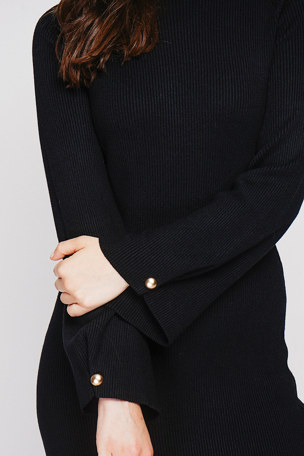 Ribbed high neck dress with buttoning on the long sleeves