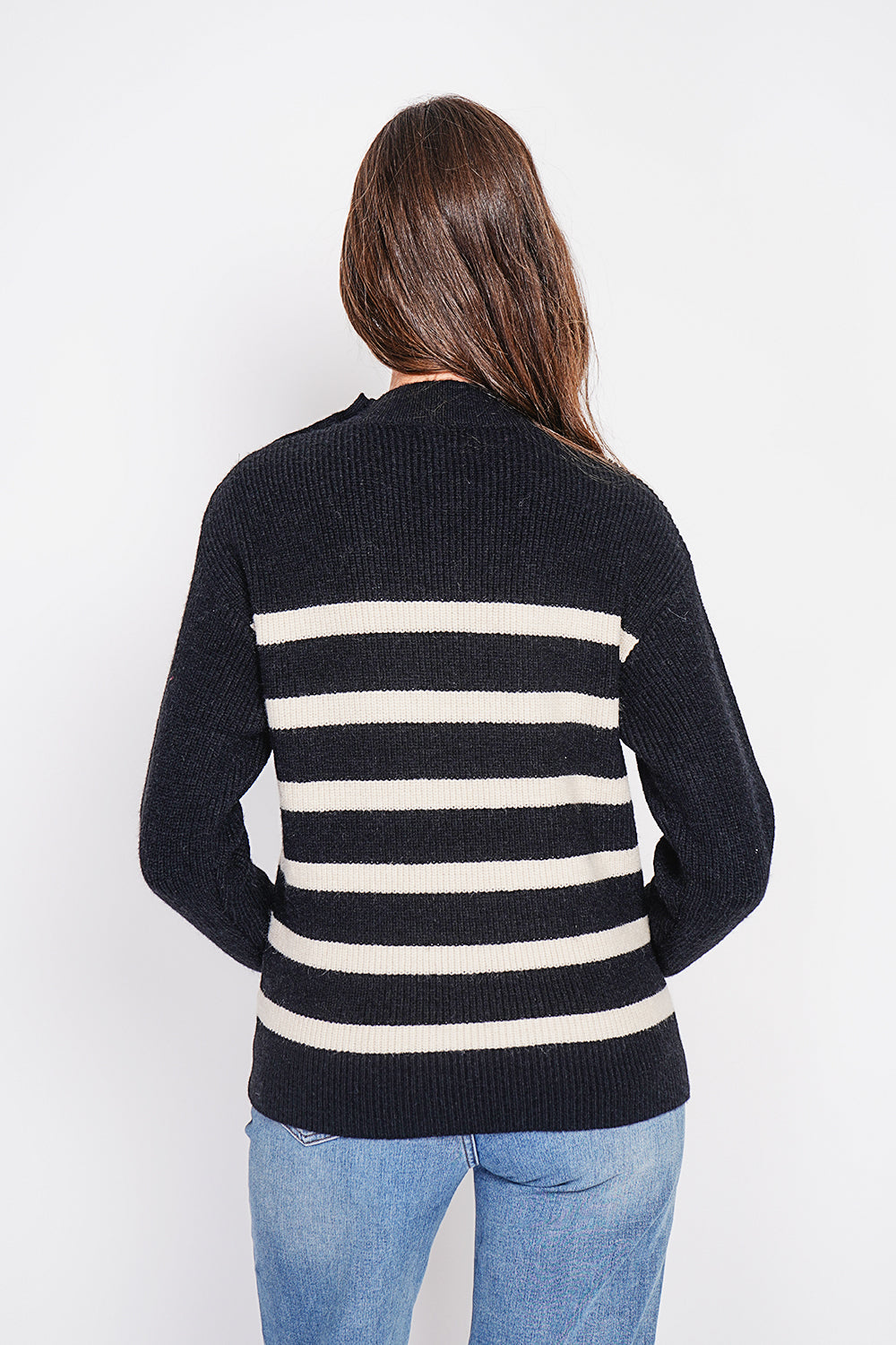 Openwork high neck sweater with buttoned shoulder and long sleeves