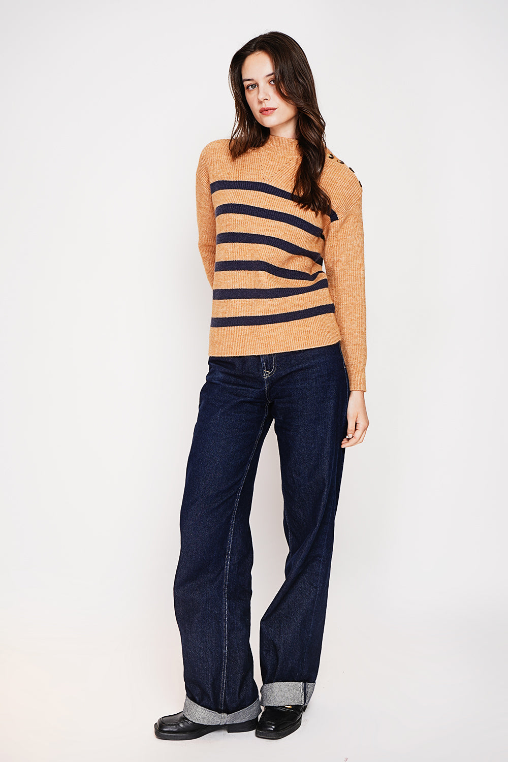 Openwork high neck sweater with buttoned shoulder and long sleeves