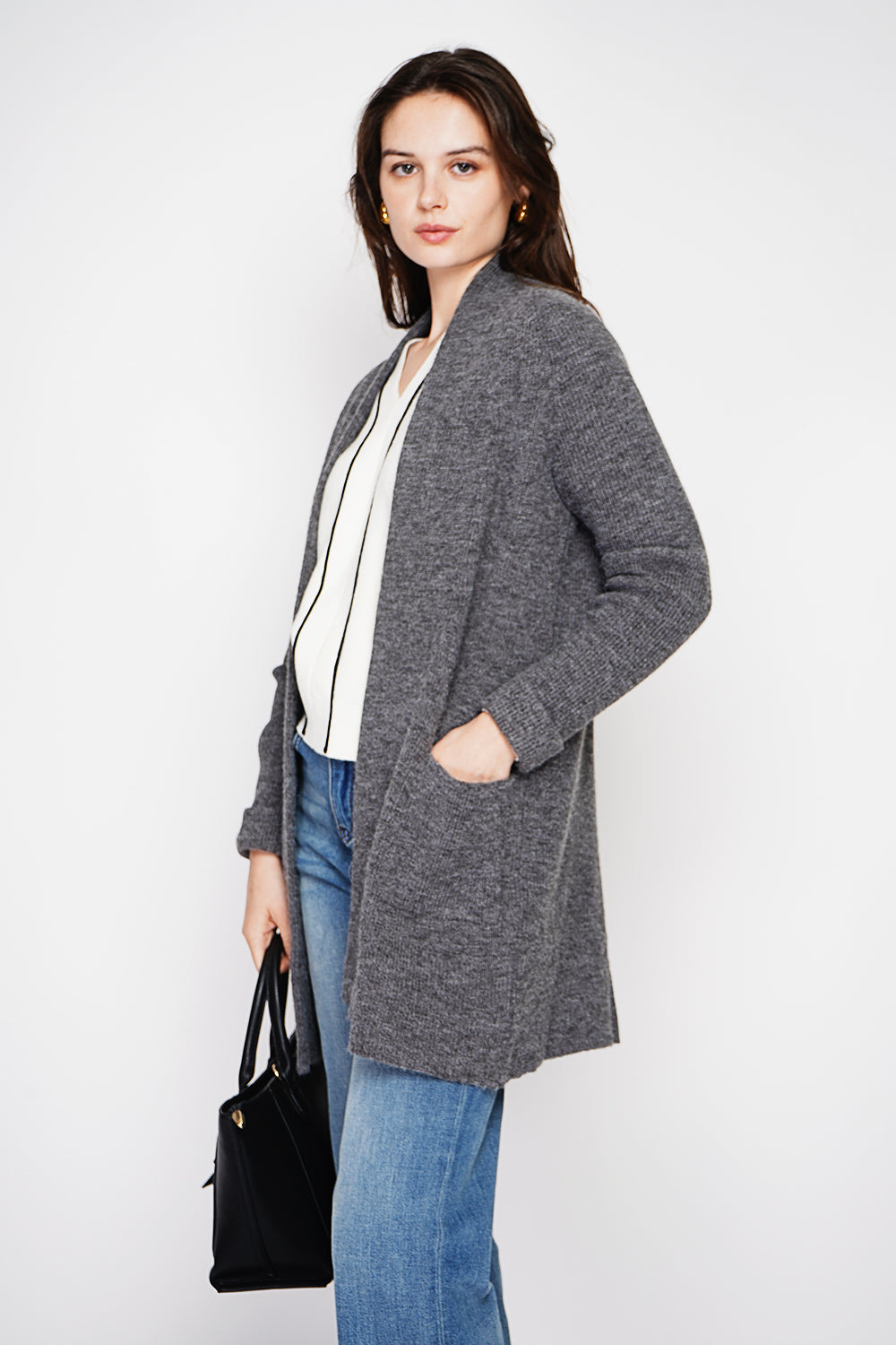 Long shawl collar cardigan with double patch pockets on the front, long sleeves and turned-in cuffs