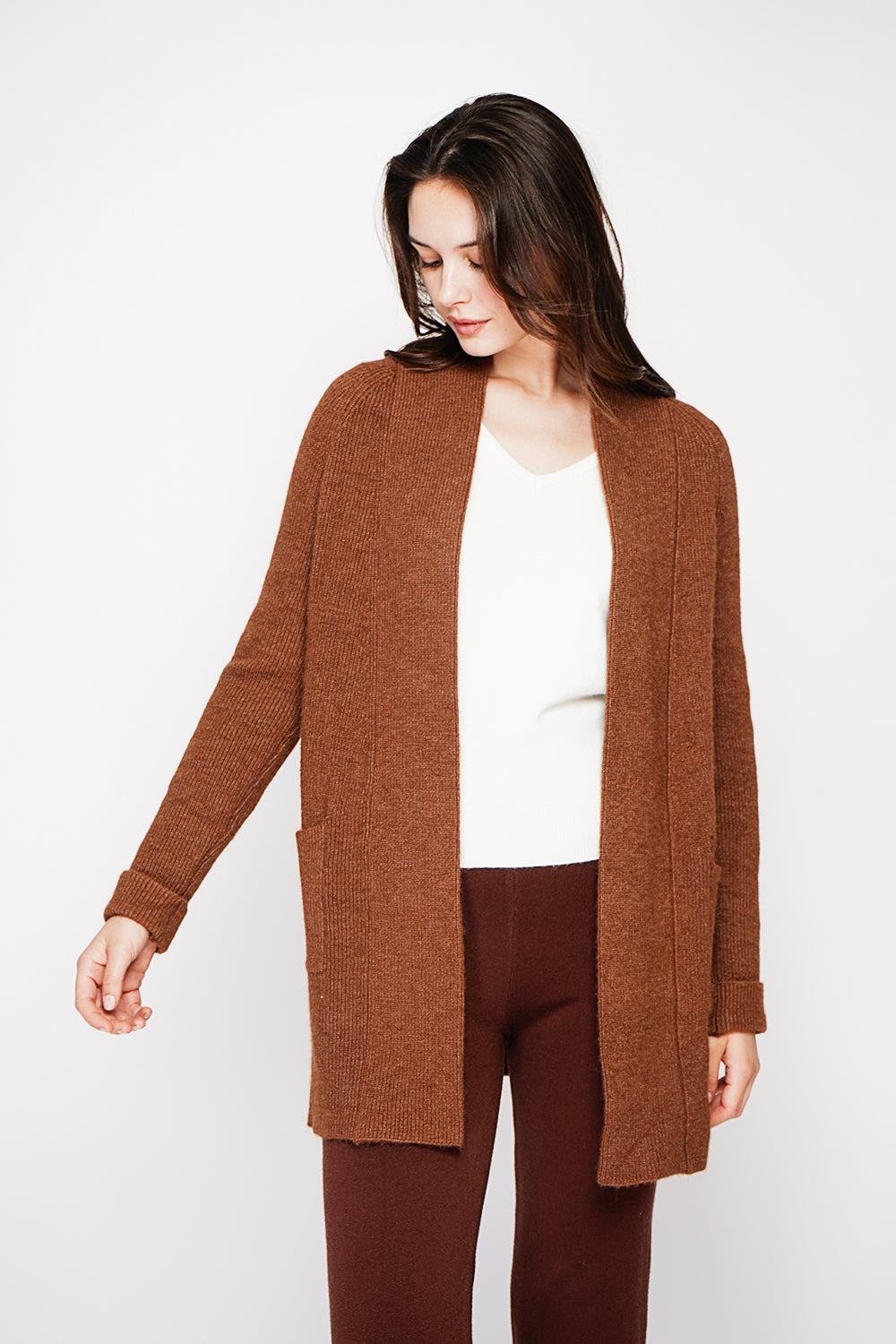 Long shawl collar cardigan with double patch pockets on the front, long sleeves and turned-in cuffs