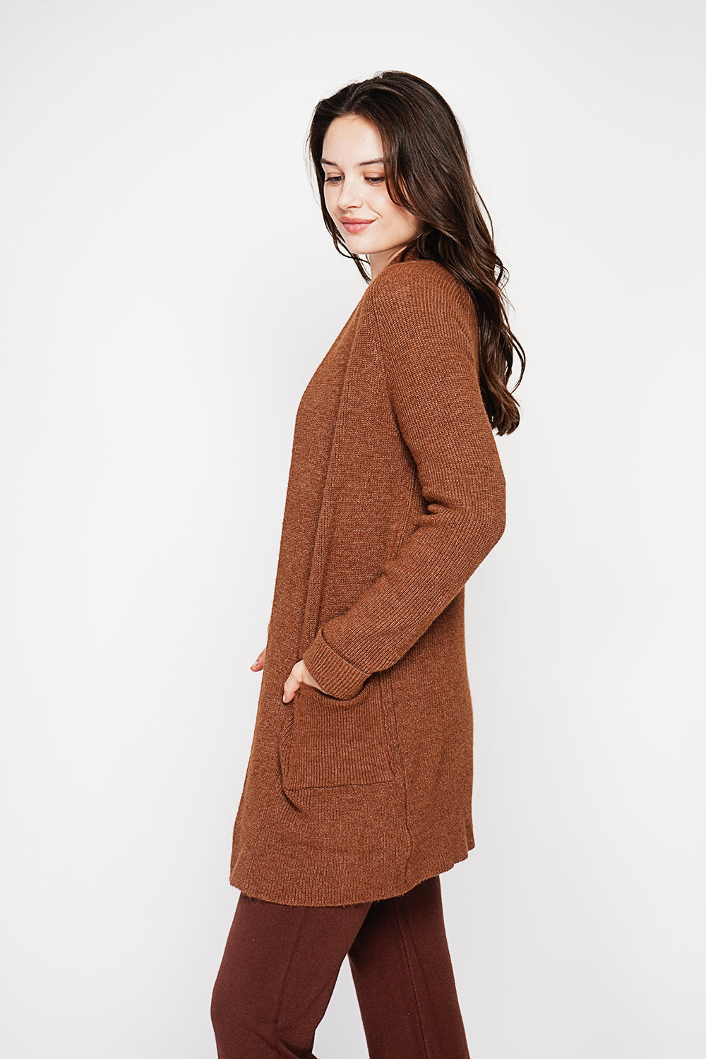 Long shawl collar cardigan with double patch pockets on the front, long sleeves and turned-in cuffs