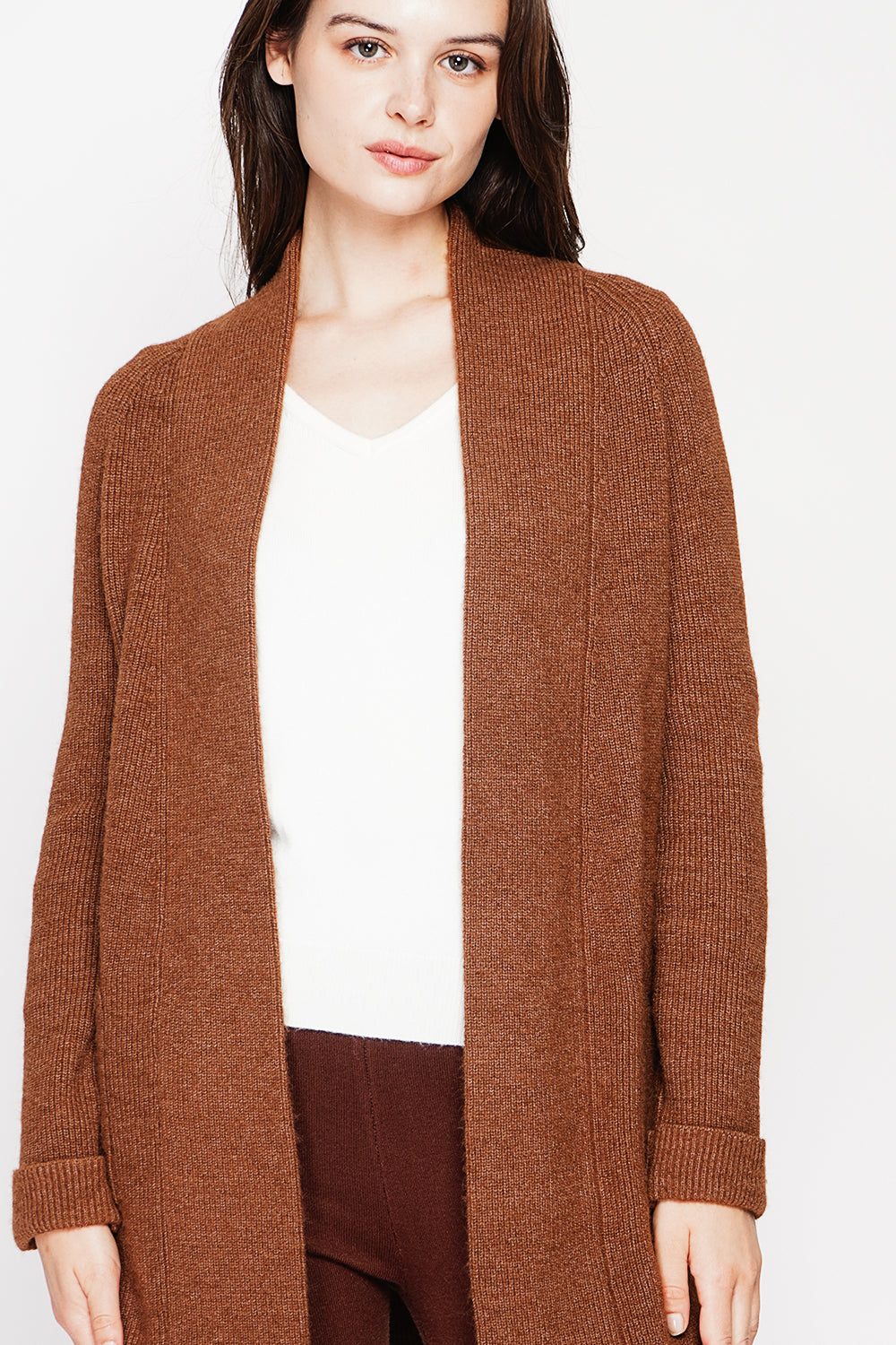 Long shawl collar cardigan with double patch pockets on the front, long sleeves and turned-in cuffs
